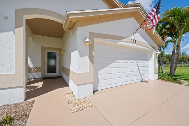 112 Camelot Court, Royal Palm Beach, FL 33411