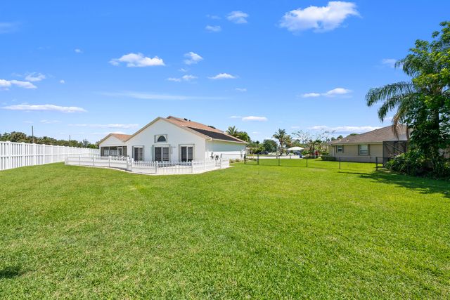 112 Camelot Court, Royal Palm Beach, FL 33411