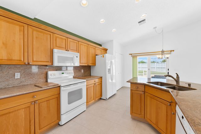 112 Camelot Court, Royal Palm Beach, FL 33411