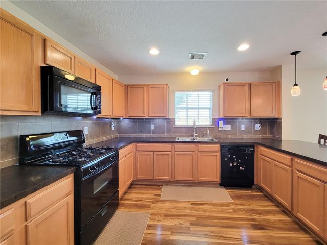 7726 Sagemark Ridge Drive, Cypress, TX 77433