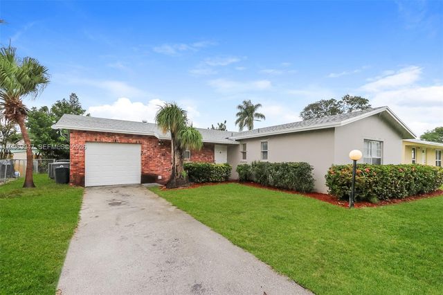 9749 Sandalfoot Boulevard, Boca Raton, FL 33428
