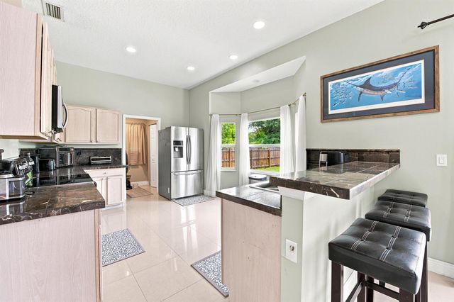 1526 SW MULLINAX Avenue, Port St. Lucie, FL 34953