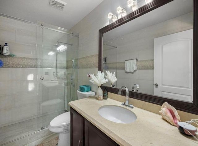 126 Hammocks Court, Greenacres, FL 33413