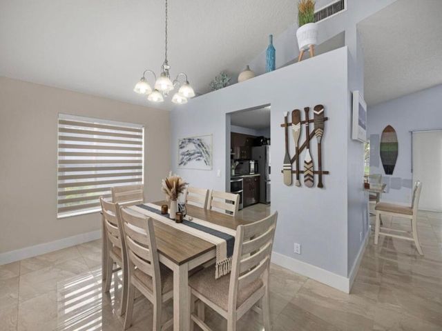 126 Hammocks Court, Greenacres, FL 33413