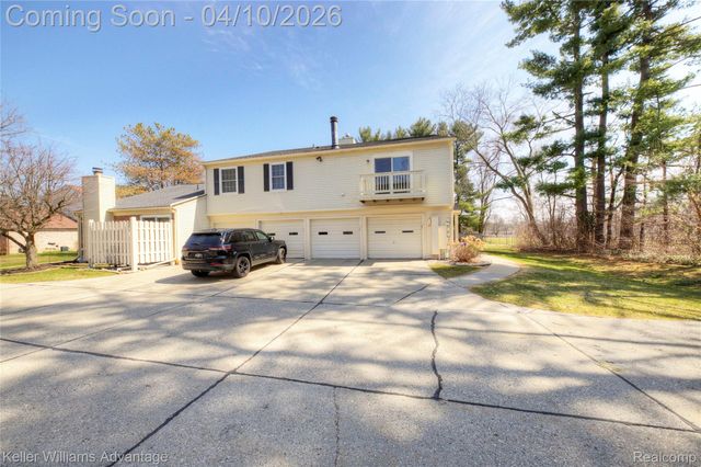 2038 Hidden Meadows Drive D, Walled Lake, MI 48390