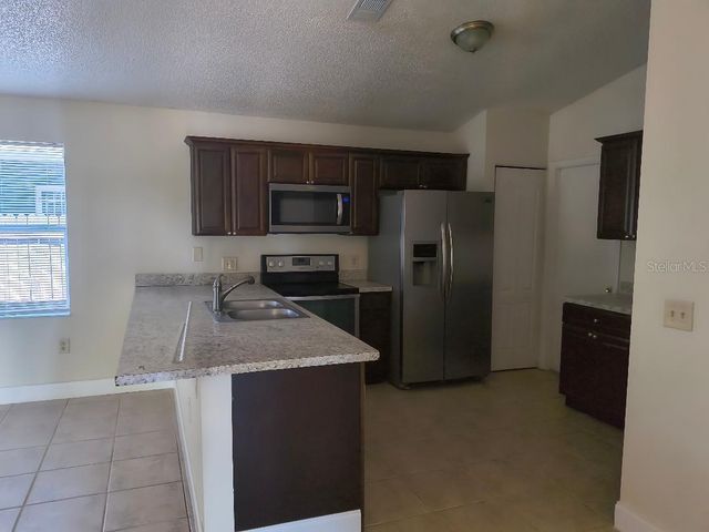 1003 WINTERBERRY LANE, Orlando, FL 32811