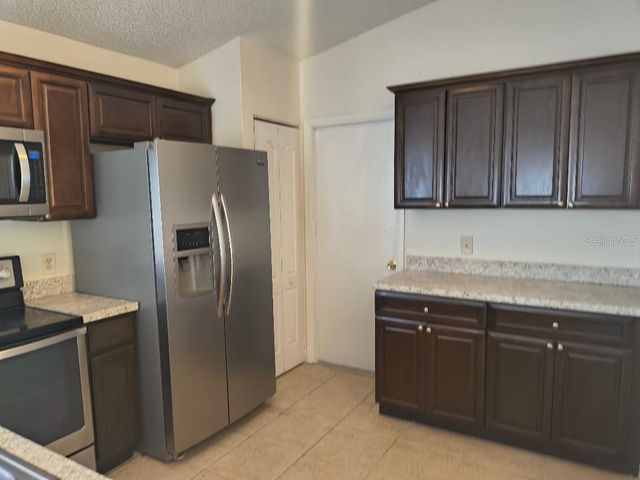 1003 WINTERBERRY LANE, Orlando, FL 32811