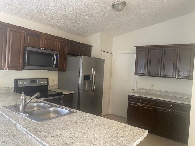 1003 WINTERBERRY LANE, Orlando, FL 32811