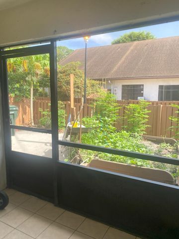 1040 PARKSIDE GREEN Drive C, Greenacres, FL 33415