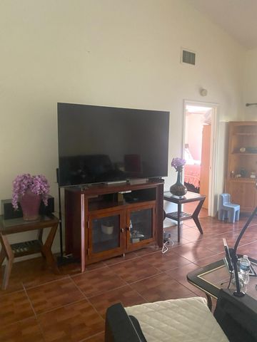 1040 PARKSIDE GREEN Drive C, Greenacres, FL 33415