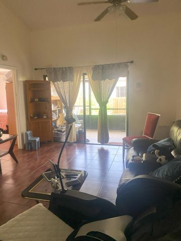 1040 PARKSIDE GREEN Drive C, Greenacres, FL 33415