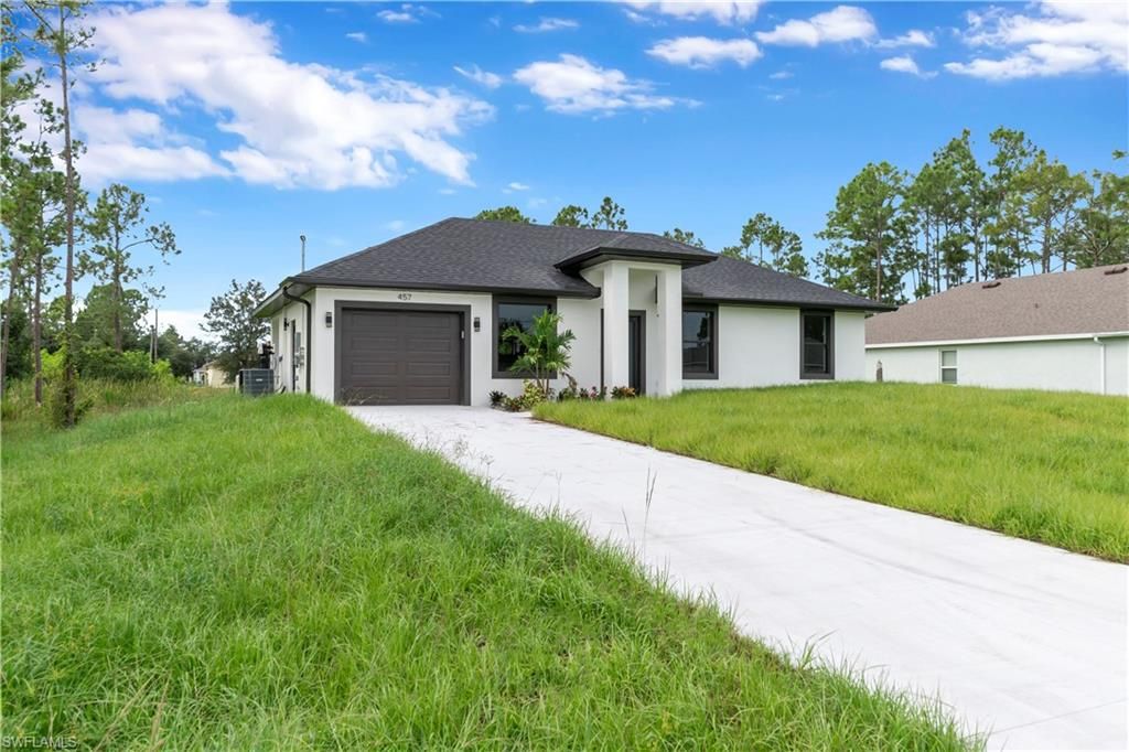 457 Woodman DR, LEHIGH ACRES, FL 33972 — photo 2