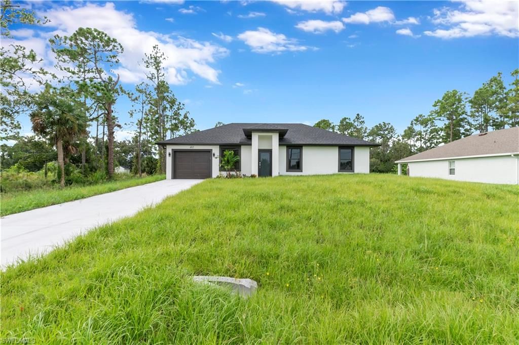 457 Woodman DR, LEHIGH ACRES, FL 33972 — photo 4
