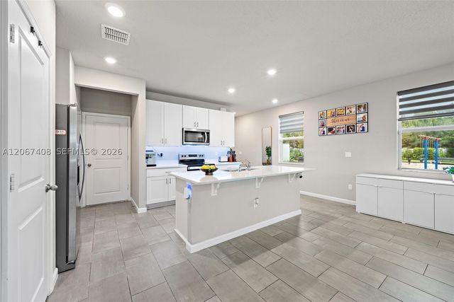 1616 Lindley St, Mangonia Park, FL 33407