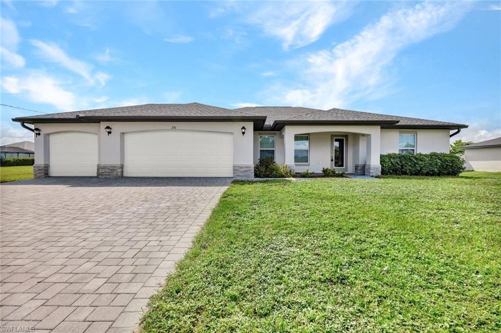 216 NW 9th TER, CAPE CORAL, FL 33993 — exterior