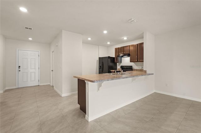 9031 WILDFLOWER LANE, Kissimmee, FL 34747
