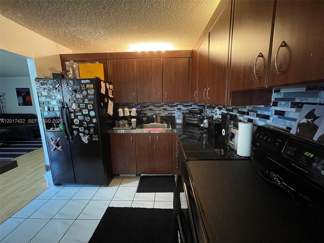 671 NE 195th St 207-E, Miami, FL 33179