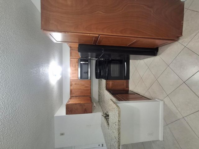 741 LYONS Road 17107, Coconut Creek, FL 33063