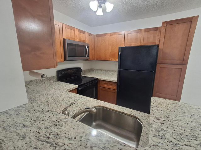 741 LYONS Road 17107, Coconut Creek, FL 33063