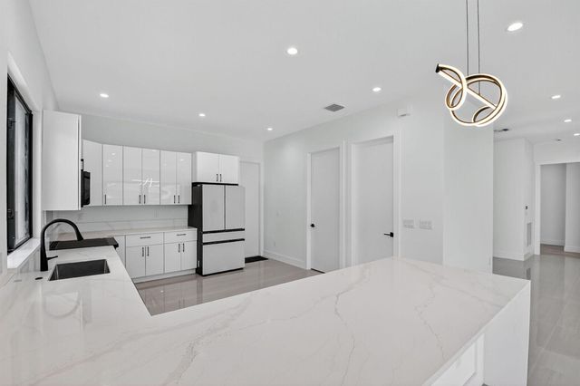 3920 Espan Court, Palm Springs, FL 33461