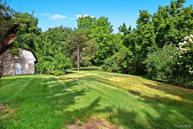 60023 Trailwood Street, Washington Township, MI 48094