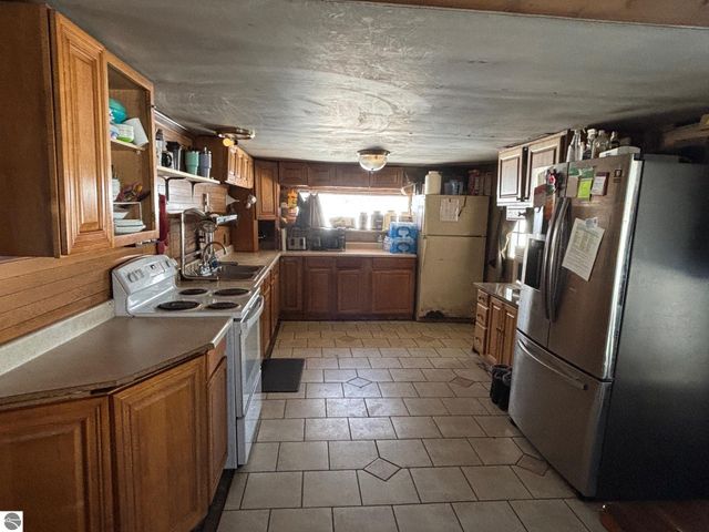 5884 Scholl Road, Mancelona, MI 49659