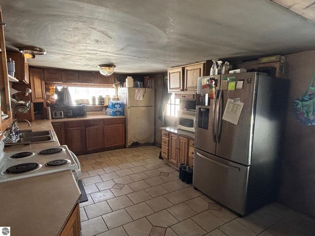 5884 Scholl Road, Mancelona, MI 49659