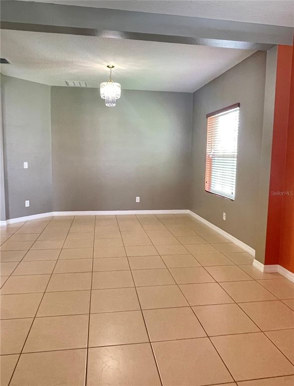 Image 3 of property listing at 12810 BOGGY VIEW DR, Orlando, FL 32824