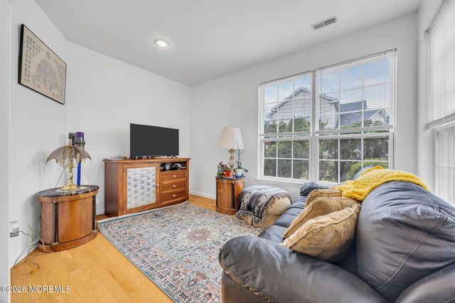 155 Point Of Woods Boulevard, Morganville, NJ 07751