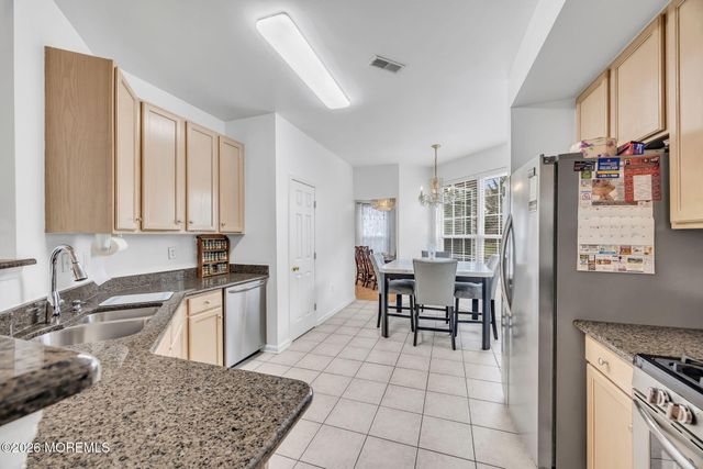 155 Point Of Woods Boulevard, Morganville, NJ 07751