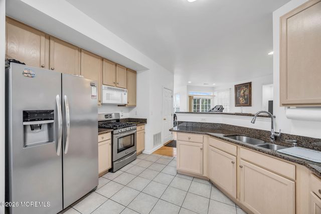 155 Point Of Woods Boulevard, Morganville, NJ 07751