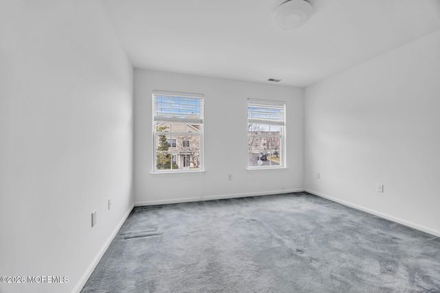 155 Point Of Woods Boulevard, Morganville, NJ 07751