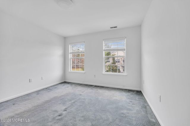 155 Point Of Woods Boulevard, Morganville, NJ 07751