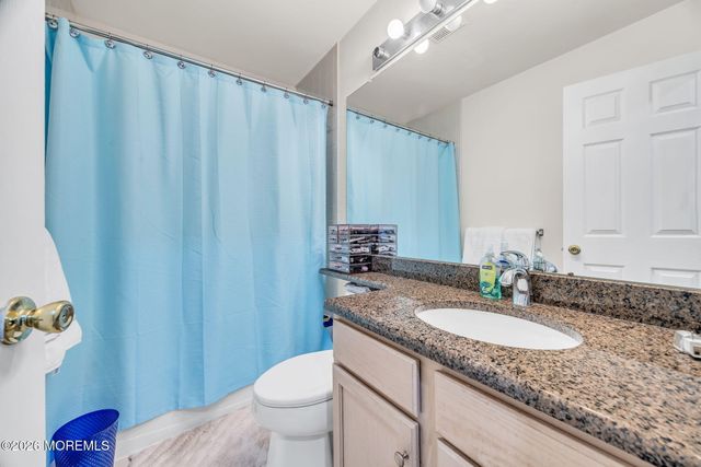 155 Point Of Woods Boulevard, Morganville, NJ 07751