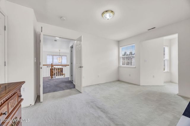 155 Point Of Woods Boulevard, Morganville, NJ 07751