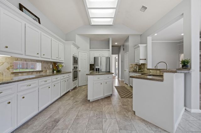 5602 Lofty Magnolia Court, Houston, TX 77345