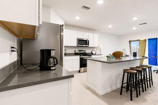 7108 BROAD RIVER AVENUE, Land O Lakes, FL 34638