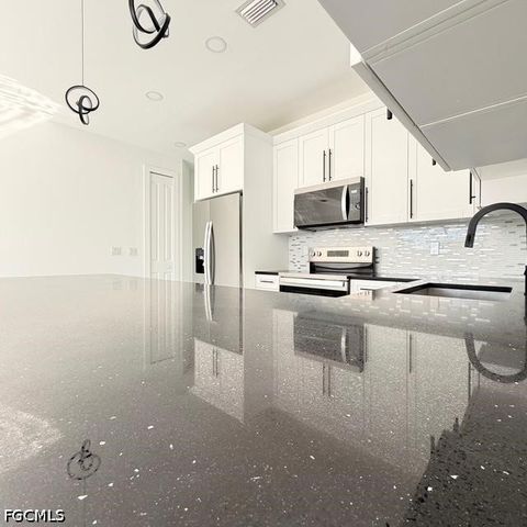 209-211 W 12th ST, Lehigh Acres, FL 33972