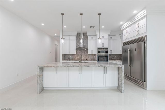 3098 Pine Tree DR, Naples, FL 34112