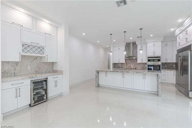3098 Pine Tree DR, Naples, FL 34112