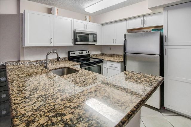 831 Lyons Rd 23101, Coconut Creek, FL 33063