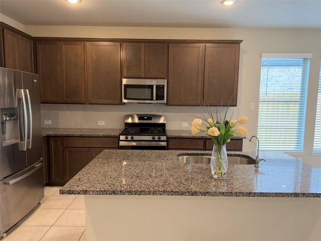 8711 Windsong Trail Drive, Missouri City, TX 77459