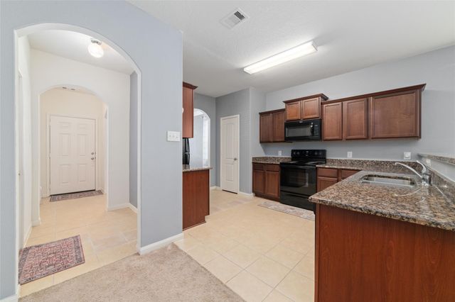 12054 Fairquarter Lane, Pinehurst, TX 77362