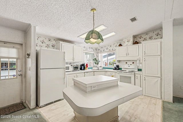 210 Kiwi Drive, Barefoot Bay, FL 32976