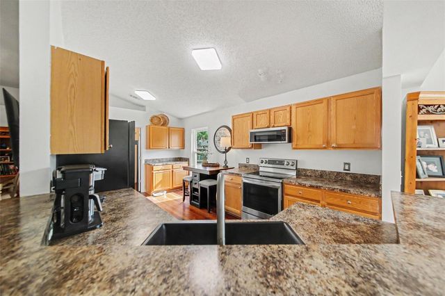 9450 WATER ORCHID AVE, Clermont, FL 34711