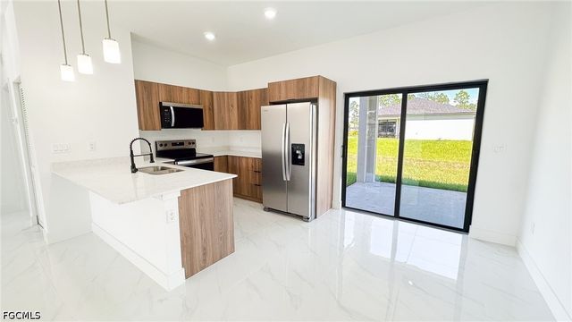 704 Asher ST E, Lehigh Acres, FL 33974