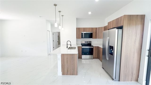 704 Asher ST E, Lehigh Acres, FL 33974