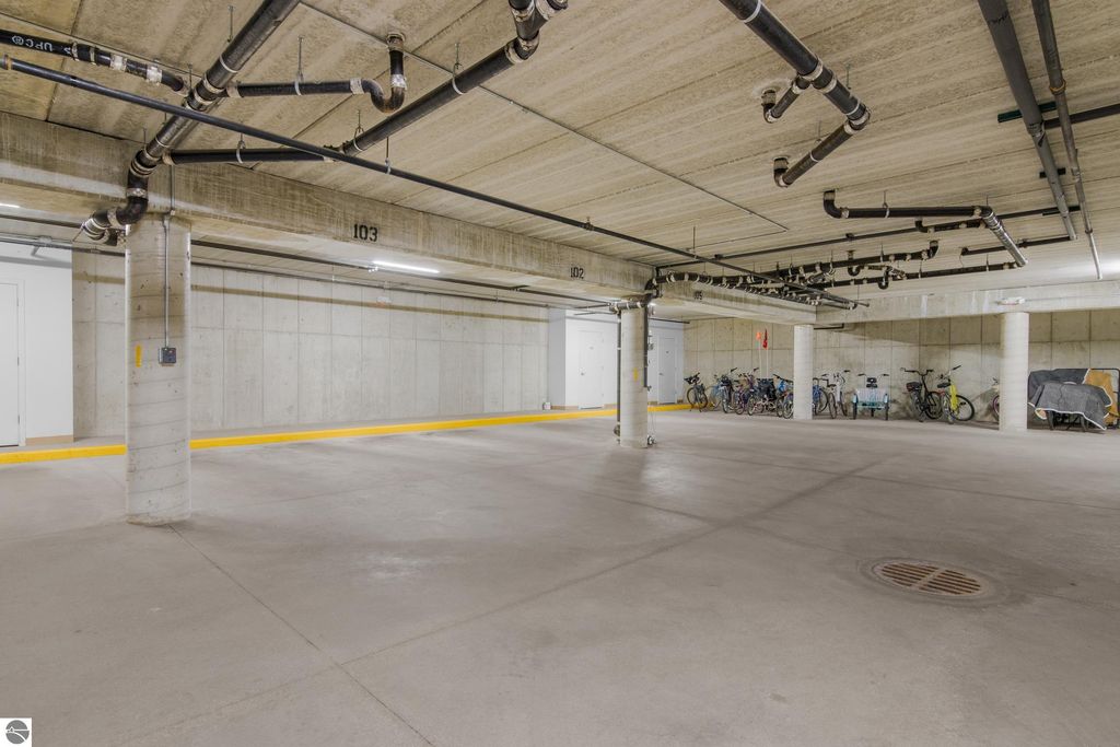 Heated underground garage parking space with assigned spot #103 and bike storage for condo at 1122 Lake Ridge Drive, Traverse City, MI.