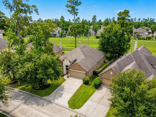 79 W Wading Pond Circle, The Woodlands, TX 77375
