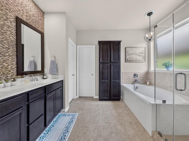 79 W Wading Pond Circle, The Woodlands, TX 77375